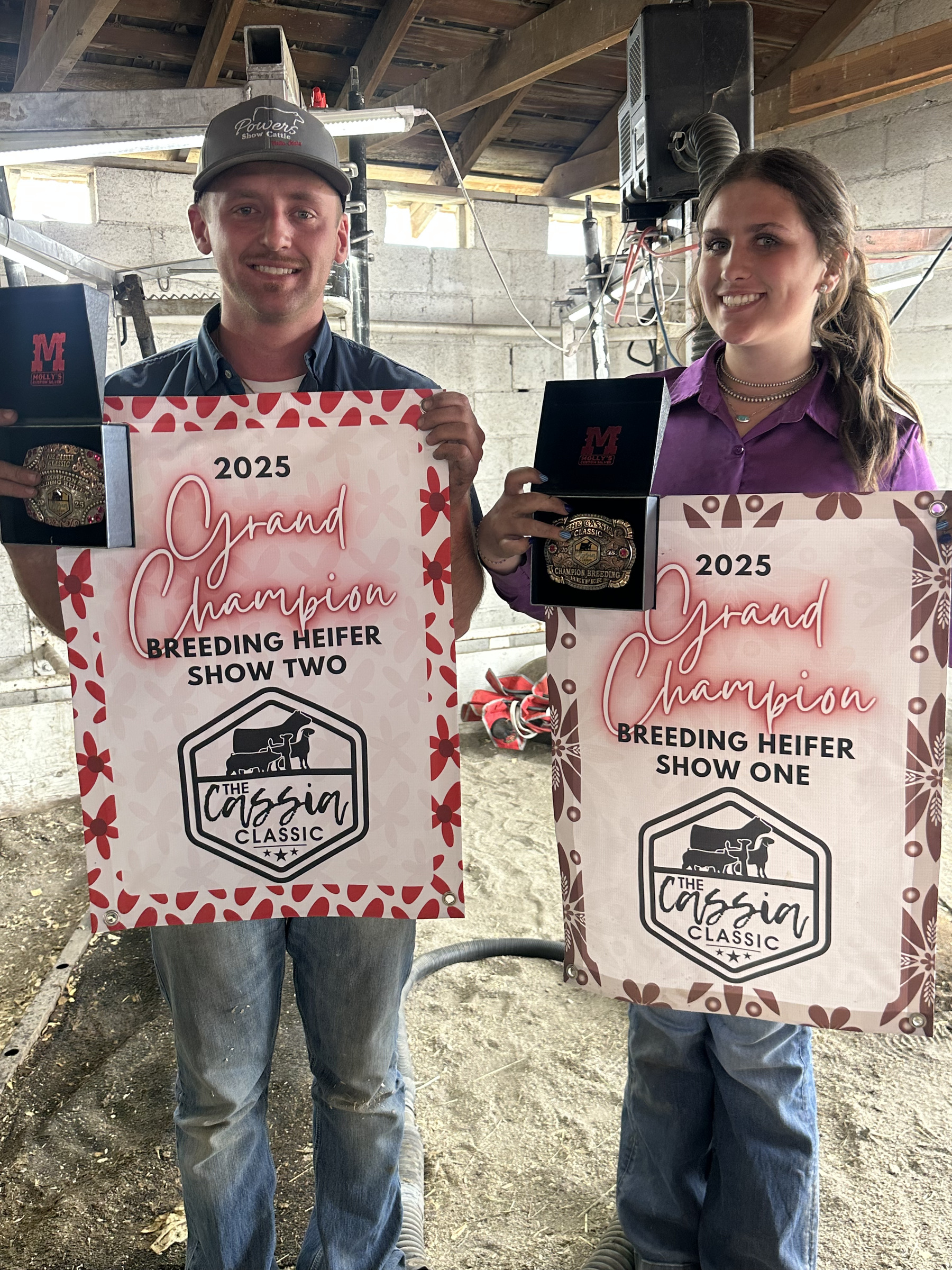 Grand Champion Breeding Heifer buckles from the 2025 Cassia Classic held up in the wash bay