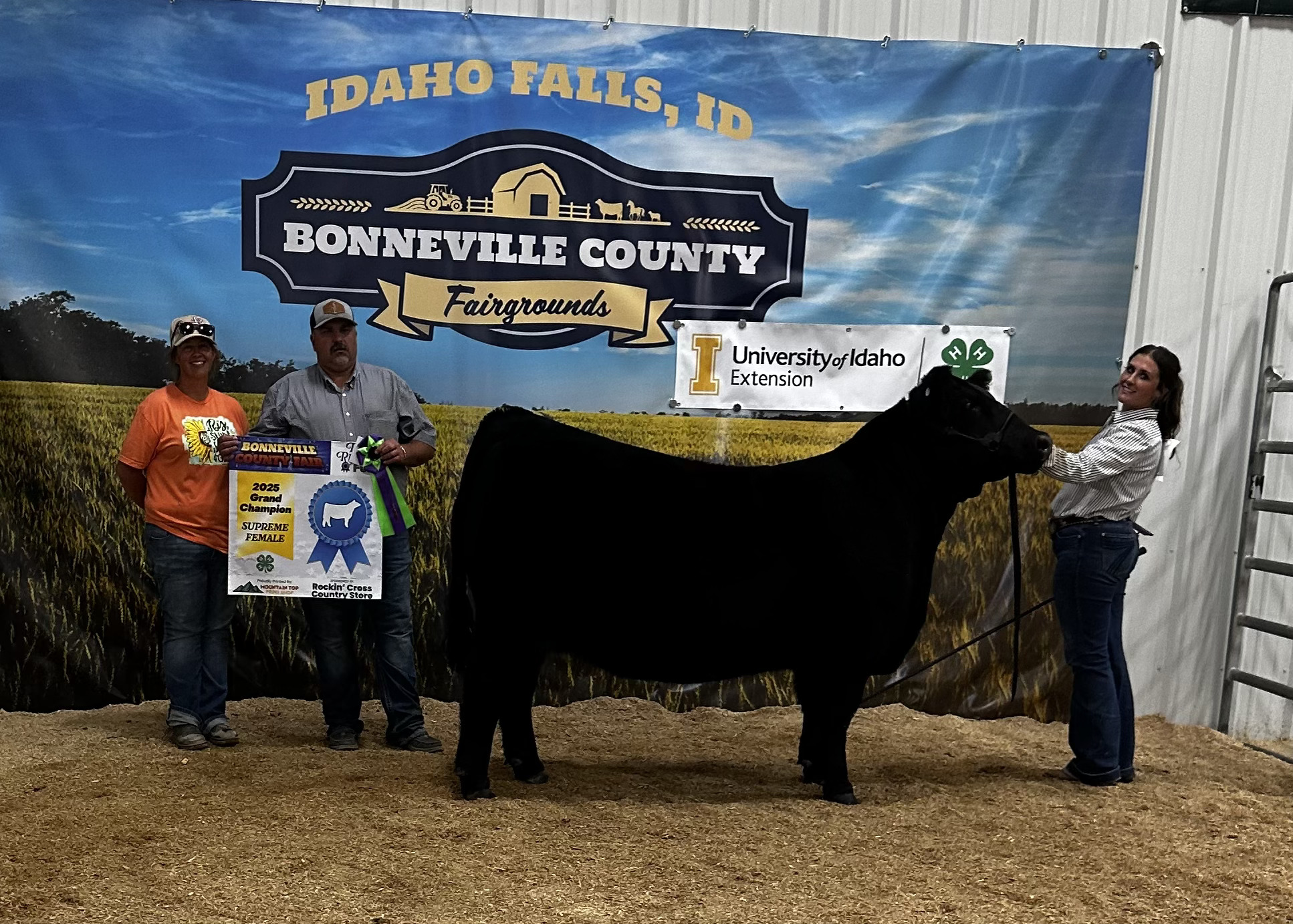Black heifer presented with the 2025 Grand Champion Supreme Female banner at the Bonneville County Fair