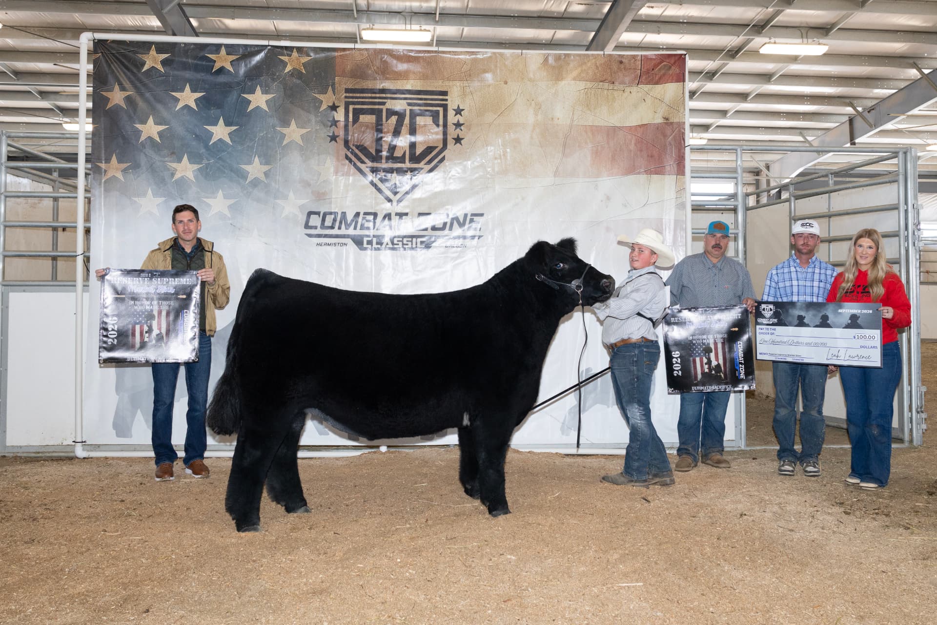 Champion drive banner photo with a black steer and award banners at the jackpot